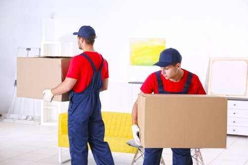 Man and van vehicle and packed moving boxes in Bayswater