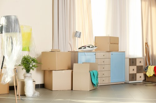 Man and van moving boxes and furniture into a vehicle