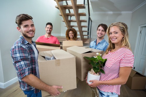 Careful loading of large furniture items for transport in Bayswater