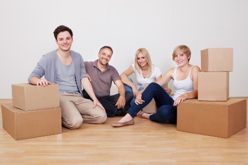 Removals crew transporting household items during a flat move in Bayswater